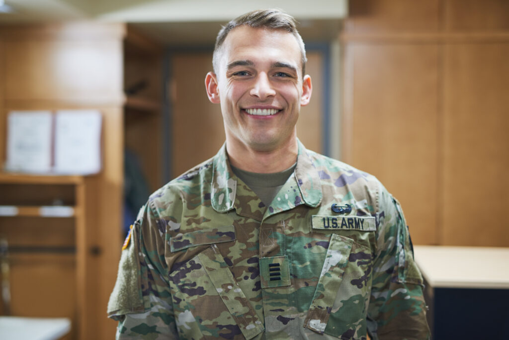 Shot of a young soldier standing in the dorms of a military academy.